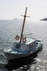 4197106-colorful-traditional-greek-small-wooden-fishing-boat-moored.jpg