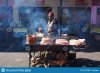 khayelitsha-south-africa-august-woman-cooking-meat-ina-township-145417856.jpg