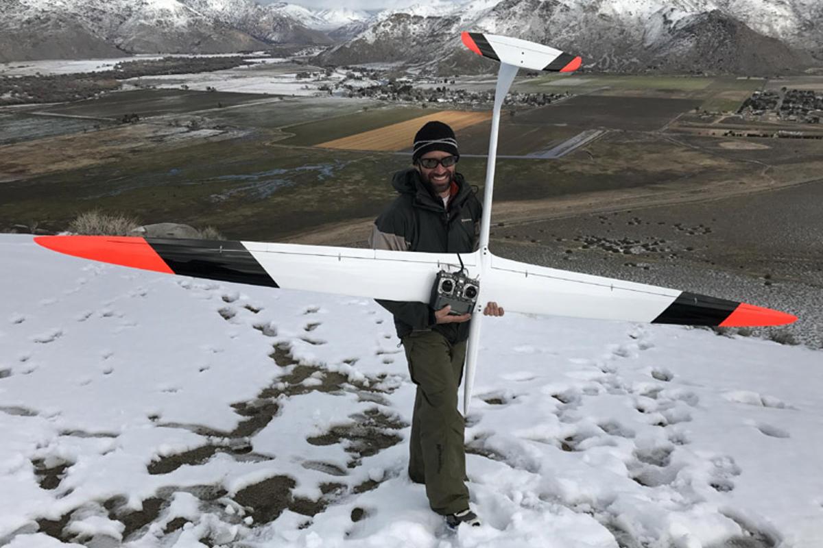 Spencer Lisenby with the massive DSKinetic 130-inch Transonic DP RC glider