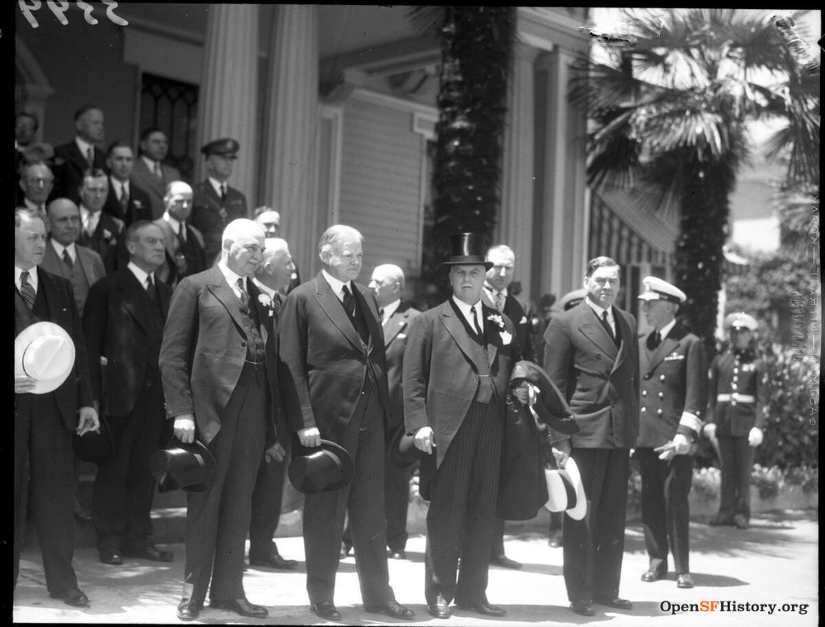 California Governor James Rolph Jr., Former US President Herbert Hoover, and San Francisco Mayor Angelo Joseph Rossi stand in front of the Admiral's residence on Yerba Buena Island during the San Francisco Bay Bridge ground breaking on July 9, 1933.